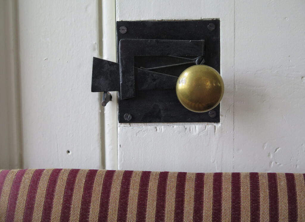 up close photo of a heritage metal door latch