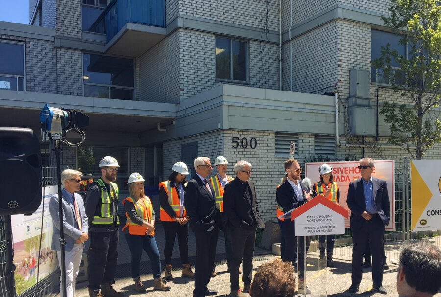 ERA Principal Graeme Stewart addresses a crowd in front of Ken Soble Tower alongside MP Adam Vaughan during the May 21, 2019 National Housing Strategy announcement.