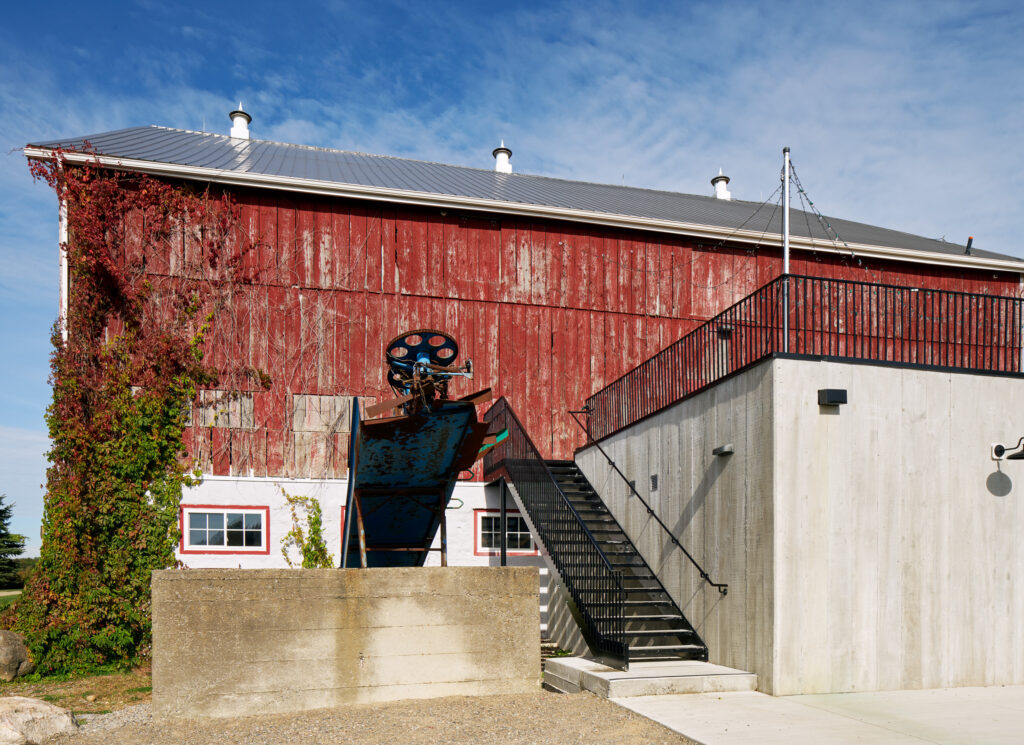 Rear exterior of Cambium Farms showing staircase and second extension