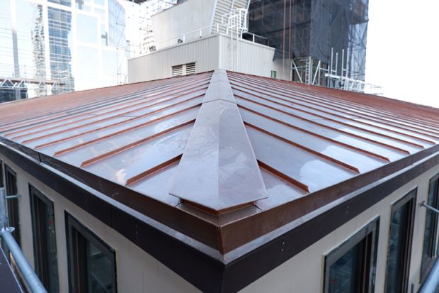 New copper penthouse roof.