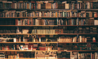 Wall of books of many sizes and ages