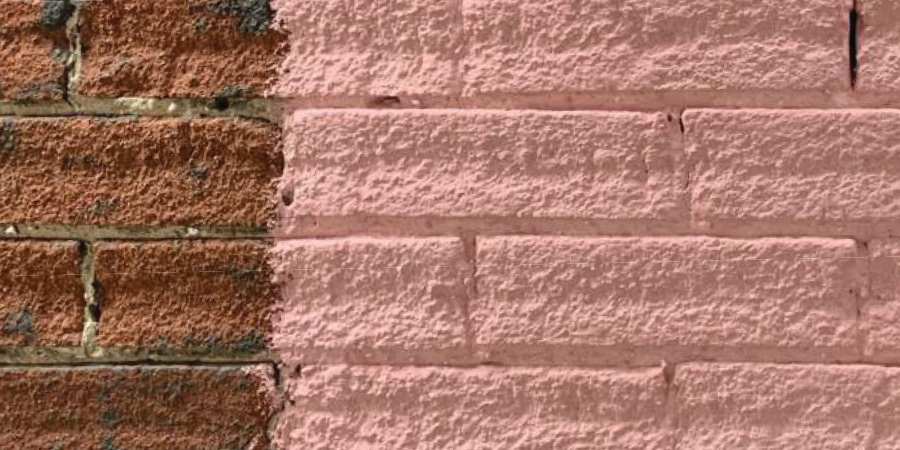Brick wall with original red brick on the left and a swatch of painted brick on the right
