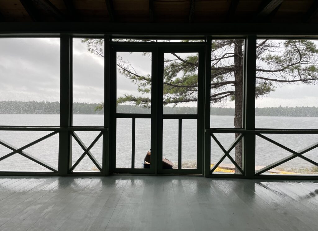 interior of enclosed porch looking out onto the bay