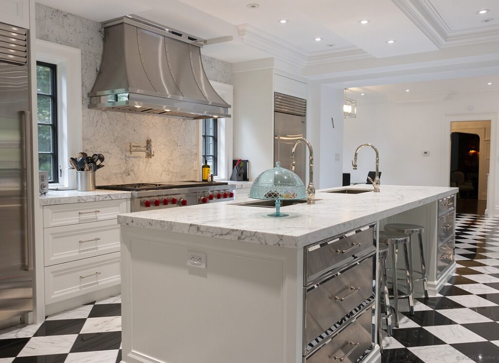photo showing a large marble kitchen island